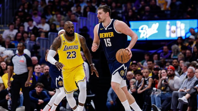Mar 5, 2026; Denver, Colorado, USA; Denver Nuggets center Nikola Jokic (15) controls the ball as Los Angeles Lakers forward LeBron James (23) guards in the fourth quarter at Ball Arena. Mandatory Credit: Isaiah J. Downing-Imagn Images