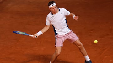 Norway's Casper Ruud returns a ball to France's Arthur Rinderknech during their 2025 ATP Tour Madrid Open tennis tournament second round singles match at the Caja Magica in Madrid, on April 25, 2025. (Photo by OSCAR DEL POZO / AFP)