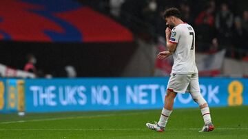 Albania&#039;s midfielder Keidi Bare leaves the game injured during the FIFA World Cup 2022 Group I qualifier football match between England and Albania at Wembley Stadium in London on November 12, 2021. (Photo by Glyn KIRK / AFP) / NOT FOR MARKETING OR A