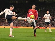 Manchester United's Brazilian midfielder #18 Casemiro (R) blovks a shot from West Ham United's English midfielder #32 Freddie Potts during the English Premier League football match between Manchester United and West Ham United at Old Trafford in Manchester, north west England, on December 4, 2025. (Photo by Oli SCARFF / AFP) / RESTRICTED TO EDITORIAL USE. No use with unauthorized audio, video, data, fixture lists, club/league logos or 'live' services. Online in-match use limited to 120 images. An additional 40 images may be used in extra time. No video emulation. Social media in-match use limited to 120 images. An additional 40 images may be used in extra time. No use in betting publications, games or single club/league/player publications. /