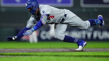 MINNEAPOLIS, MN - APRIL 12: Chris Taylor #3 of the Los Angeles Dodgers slides into third base after hitting a triple against the Minnesota Twins in the seventh inning of the game at Target Field on April 12, 2022 in Minneapolis, Minnesota.   David Berding/Getty Images/AFP
== FOR NEWSPAPERS, INTERNET, TELCOS & TELEVISION USE ONLY ==