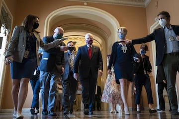 Senate Majority Leader Mitch McConnell (R-KY) is swarmed by reporters as he leaves the Senate floor and walks to his office at the U.S. Capitol on 30 July 2020.