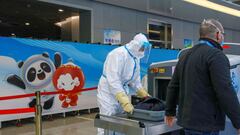 A security guard wearing personal protective equipment works at Zhangjiakou cluster train station inside a closed loop area designed to prevent the spread of the coronavirus disease in Zhangjiakou, ahead of the Beijing 2022 Winter Olympics.