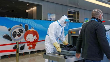 A security guard wearing personal protective equipment works at Zhangjiakou cluster train station inside a closed loop area designed to prevent the spread of the coronavirus disease in Zhangjiakou, ahead of the Beijing 2022 Winter Olympics.