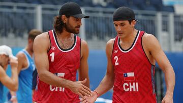 TOKYO, JAPAN - AUGUST 02: Marco Grimalt #1 of Team Chile and Esteban Grimalt #2 react after the play against Team ROC during the Men&#039;s Round of 16 beach volleyball on day ten of the Tokyo 2020 Olympic Games at Shiokaze Park on August 02, 2021 in Tokyo, Japan. (Photo by Sean M. Haffey/Getty Images)