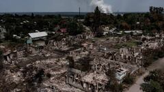 An aerial view shows destroyed houses after strike in the town of Pryvillya at the eastern Ukrainian region of Donbas on June 14, 2022, amid Russian invasion of Ukraine. - The cities of Severodonetsk and Lysychansk, which are separated by a river, have been targeted for weeks as the last areas still under Ukrainian control in the eastern Lugansk region. (Photo by ARIS MESSINIS / AFP) (Photo by ARIS MESSINIS/AFP via Getty Images)