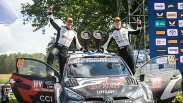 Kalle Rovanpera of Finland and his co-driver Jonne Halttunen of Finland celebrate after the the WRC TET Rally Latvia WRC event on July 21, 2024 in Krogzemji, Priekule, Latvia. (Photo by Gints Ivuskans / AFP)