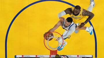 May 10, 2023; San Francisco, California, USA; Golden State Warriors guard Stephen Curry (30) shoots the basketball against Los Angeles Lakers forward LeBron James (6) during the second half in game five of the 2023 NBA playoffs conference semifinals round at Chase Center. Mandatory Credit: Kyle Terada-USA TODAY Sports