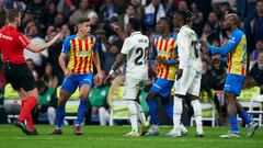 MADRID, SPAIN - FEBRUARY 02: Vinicius Junior of Real Madrid argues with Gabriel Paulista of Valencia CF during the LaLiga Santander match between Real Madrid CF and Valencia CF at Estadio Santiago Bernabeu on February 02, 2023 in Madrid, Spain. (Photo by Mateo Villalba/Quality Sport Images/Getty Images)