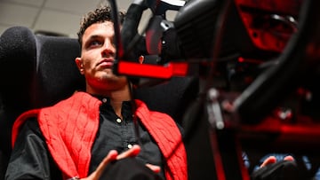 McLaren's Formula One British driver Lando Norris races in a simulator at Macy's Flagship Aventura Store for a meet-and-greet event in Aventura, Florida, on April 29, 2025. (Photo by CHANDAN KHANNA / AFP)