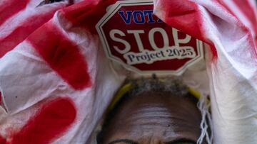 Activist Nadine Seiler of Maryland, wears a sign which reads, "Vote, Stop Project 2025," in reference to a set of conservative policy proposals, along the perimeter of the Republican National Convention in Milwaukee, Wisconsin, U.S., July 17, 2024. REUTERS/Adrees Latif