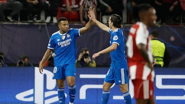 Soccer Football - UEFA Champions League - Olympiacos v Real Madrid - Georgios Karaiskakis Stadium, Piraeus, Greece - November 26, 2025 Real Madrid's Kylian Mbappe celebrates scoring their fourth goal with Alvaro Carreras REUTERS/Louiza Vradi
