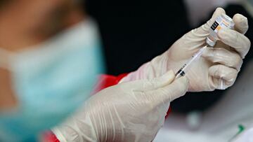 FILE PHOTO: A health care worker prepares a dose of China&#039;s Sinovac Biotech vaccine for the coronavirus disease (COVID-19), during the mass vaccination program at the Tangerang City Government Center, in Tangerang on the outskirts of Jakarta, Indones