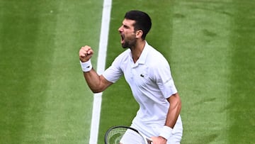 Serbia's Novak Djokovic celebrates winning the third set against Russia's Andrey Rublev during their men's singles quarter-finals tennis match on the ninth day of the 2023 Wimbledon Championships at The All England Tennis Club in Wimbledon, southwest London, on July 11, 2023. (Photo by SEBASTIEN BOZON / AFP) / RESTRICTED TO EDITORIAL USE