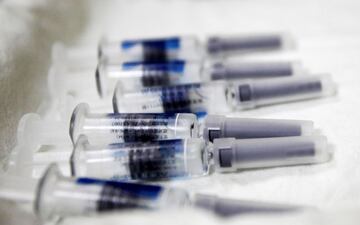 FILE PHOTO: Vaccines are placed on a tray