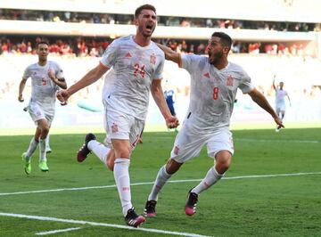 Aymeric Laporte (L) of Spain celebraes with team-mates after scoring the team's second goal during the UEFA EURO 2020 group E preliminary round soccer match between Slovakia and Spain in Seville, Spain, 23 June 2021.