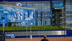 A man stands outside the arena and the training ground pof the Bundesliga football club Schalke 04 in Gelsenkirchen, western Germany, where fans demonstrate to protest against the club&#039;s management on June 27, 2020, at the same time as the kick-off o