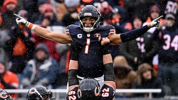 Dec 31, 2023; Chicago, Illinois, USA;  Chicago Bears quarterback Justin Fields (1) celebrates with offensive lineman Lucas Patrick (62) after running for a 9-yard touchdown in the first half against the Atlanta Falcons at Soldier Field. Mandatory Credit: Jamie Sabau-USA TODAY Sports     TPX IMAGES OF THE DAY