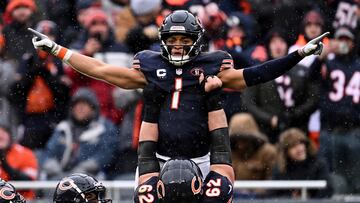 Dec 31, 2023; Chicago, Illinois, USA;  Chicago Bears quarterback Justin Fields (1) celebrates with offensive lineman Lucas Patrick (62) after running for a 9-yard touchdown in the first half against the Atlanta Falcons at Soldier Field. Mandatory Credit: Jamie Sabau-USA TODAY Sports     TPX IMAGES OF THE DAY