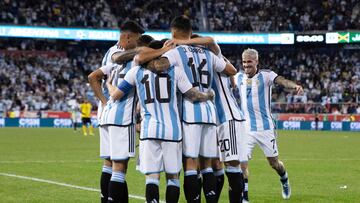 Argentina's Lionel Messi (10) celebrates his goal with teammates during the international friendly football match between Argentina and Jamaica at Red Bull Arena in Harrison, New Jersey, on September 27, 2022. (Photo by Andres Kudacki / AFP)