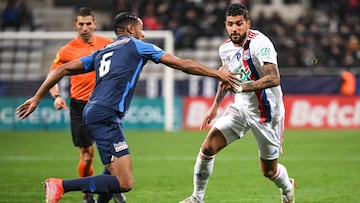 Lyon's Italian defender Emerson Palmieri (R) and Paris FC's French defender Samir Chergui (L) fight for the ball during the French Cup round of 64 football match between Paris FC and Olympique Lyonnais (OL) at the Charlety stadium in Paris, on December 17, 2021. (Photo by Bertrand GUAY / AFP)