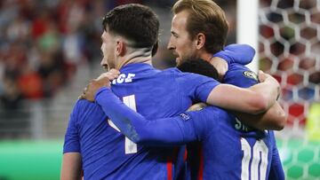 England&#039;s Declan Rice, left, and Raheem Sterling, bottom right, celebrate with Harry Kane, top right, who scored his side&#039;s second goal during the World Cup 2022 group I qualifying soccer match between Hungary and England at the Ferenc Puskas st