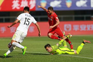 Moraes #9 of Tianjin Quanjian and Sun Jie #15 of Changchun Yatai compete for the ball during the eighth round match of 2017 Chinese Football Association Super League (CSL) on May 6, 201.