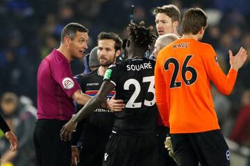 Referee Andre Marriner talks to Crystal Palace's Pape Souare and Yohan Cabaye at the end of the match.