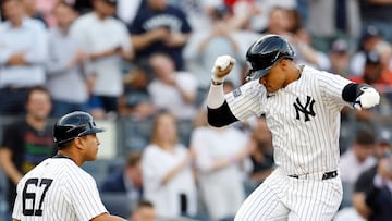 NEW YORK, NEW YORK - MAY 08: Juan Soto #22 celebrates with third base coach Luis Rojas #67 of the New York Yankees after hitting a two-run home run during the first inning against the Houston Astros at Yankee Stadium on May 08, 2024 in the Bronx borough of New York City.   Sarah Stier/Getty Images/AFP (Photo by Sarah Stier / GETTY IMAGES NORTH AMERICA / Getty Images via AFP)