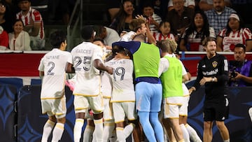 Aug 4, 2024; Carson, California, USA;  Los Angeles Galaxy midfielder Riqui Puig (10, top) celebrates a goal scored by forward Gabriel Pec (not shown) during the second half against the Chivas Guadalajara at Dignity Health Sports Park. Mandatory Credit: Kiyoshi Mio-USA TODAY Sports