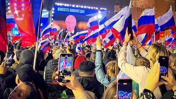 People attend a rally and a concert marking the annexation of four regions of Ukraine Russian troops occupy - Lugansk, Donetsk, Kherson and Zaporizhzhia, at Red Square in central Moscow on September 30, 2022. (Photo by STRINGER / AFP) (Photo by STRINGER/AFP via Getty Images)