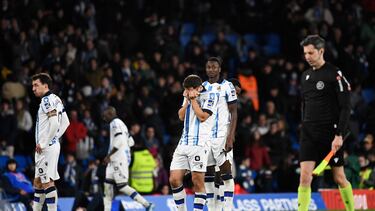 Real Sociedad's Spanish defender #06 Aritz Elustondo and teammates react after losing the Spanish Copa del Rey (King's Cup) semi final second leg football match between Real Sociedad and RCD Mallorca at the Anoeta stadium in San Sebastian on February 27, 2024. (Photo by ANDER GILLENEA / AFP)