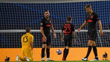 Atletico Madrid's Spanish midfielder Koke (2L) and teammates react to Leipzig's Spanish midfielder Dani Olmo's goal during the UEFA Champions League quarter-final football match between Leipzig and Atletico Madrid at the Jose Alvalade stadi