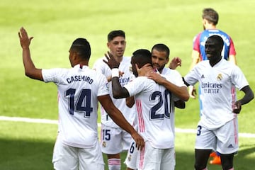 Vinicius is congratulated by his Real Madrid teammates after his opening goal against Levante.