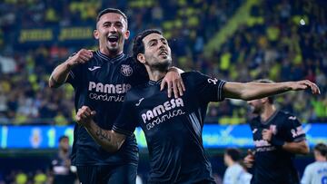 Villarreal's Spanish midfielder #10 Daniel Parejo (R) celebrates with teammate Villarreal's Spanish forward #21 Yeremi Pino after scoring their second goal during the Spanish league football match between Villarreal CF and Deportivo Alaves at La Ceramica stadium in Vila-real on November 9, 2024. (Photo by JOSE JORDAN / AFP)