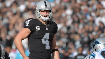 Nov 27, 2016; Oakland, CA, USA; Oakland Raiders quarterback Derek Carr (4) scans the defense before taking the snap against the Carolina Panthers during the first half at Oakland-Alameda County Coliseum. Mandatory Credit: Kirby Lee-USA TODAY Sports ORG XMIT: USATSI-268572 ORIG FILE ID:  20161127_gav_al2_058.jpg