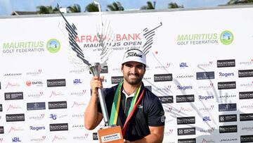 PORT LOUIS, MAURITIUS - DECEMBER 18: Antoine Rozner of France celebrates with the trophy after winning on Day Four of the AfrAsia Bank Mauritius Open at Mont Choisy Le Golf on December 18, 2022 in Port Louis, Mauritius. (Photo by Stuart Franklin/Getty Images)