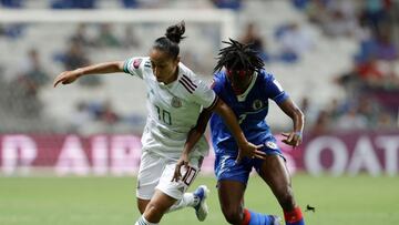 Soccer Football - Concacaf Women Championship - Group A - Haiti v Mexico - Estadio BBVA, Monterrey, Mexico - July 7, 2022 Mexico's Stephany Mayor in action with Haiti's Batcheba Louis REUTERS/Daniel Becerril