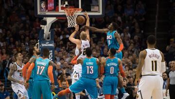 Nov 24, 2018; Oklahoma City, OK, USA; Denver Nuggets forward Mason Plumlee (24) has the ball knocked away by Oklahoma City Thunder forward Jerami Grant (9) during the third quarter at Chesapeake Energy Arena. Mandatory Credit: Rob Ferguson-USA TODAY Sports