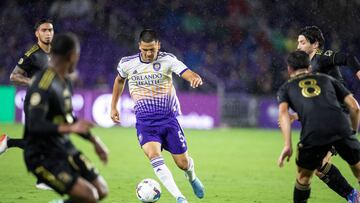 Orlando City midfielder César Araújo (5) dribbles past Los Angeles FC defenders during an MLS soccer match in Orlando, Fla., Saturday, April 2, 2022. (Willie J. Allen Jr./Orlando Sentinel via AP)