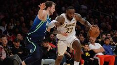 December 1, 2019; Los Angeles, CA, USA; Los Angeles Lakers forward LeBron James (23) moves the ball against Dallas Mavericks forward Luka Doncic (77) during the second half at Staples Center. Mandatory Credit: Gary A. Vasquez-USA TODAY Sports