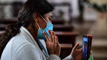 Adriana Beramendi, mother of quadruplets, uses her mobile phone to speak with her husband -who is in Bolivia- at the Ramon Sarda Maternity Hospital in Buenos Aires, on July 7, 2020, amid the new coronavirus pandemic. - Beramendi gave birth to the babies about 1,500 km away from her Bolivian husband, who is not allowed to enter Argentina since the borders remain closed to prevent the spread of the new coronavirus. (Photo by RONALDO SCHEMIDT / AFP)