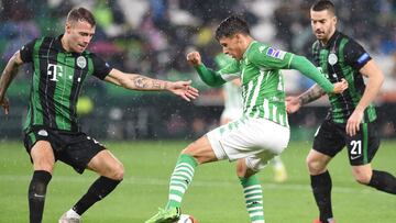 Ferencvaros&#039; Slovenian defender Miha Blazic (L) vies with Real Betis&#039; Spanish midfielder Cristian Tello during the UEFA Europa League first round group G football match between Real Betis and Ferencvaros at the Benito Villamarin stadium in Sevil