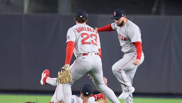 Oct 2, 2025; Bronx, New York, USA; The batted ball New York Yankees outfielder Cody Bellinger falls between Boston Red Sox outfielder Ceddanne Rafaela (3), second baseman Romy Gonzalez (23) and outfielder Wilyer Abreu (52) for a double in the fourth inning during game three of the Wildcard round for the 2025 MLB playoffs at Yankee Stadium. Mandatory Credit: Vincent Carchietta-Imagn Images