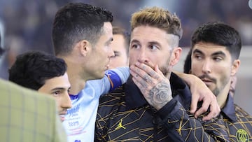 Paris Saint-Germain's Spanish defender Sergio Ramos (C) chats with Riyadh All-Star's Portuguese forward Cristiano Ronaldo (Center-L) during the Riyadh Season Cup football match between the Riyadh All-Stars and Paris Saint-Germain at the King Fahd Stadium in Riyadh on January 19, 2023. (Photo by Giuseppe CACACE / AFP)