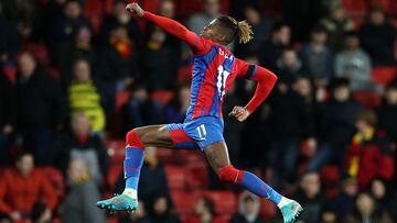 WATFORD, ENGLAND - FEBRUARY 23: Wilfried Zaha of Crystal Palace celebrates after scoring their team's fourth goal during the Premier League match between Watford and Crystal Palace at Vicarage Road on February 23, 2022 in Watford, England. (Photo by