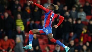 WATFORD, ENGLAND - FEBRUARY 23: Wilfried Zaha of Crystal Palace celebrates after scoring their team&#039;s fourth goal during the Premier League match between Watford and Crystal Palace at Vicarage Road on February 23, 2022 in Watford, England. (Photo by 