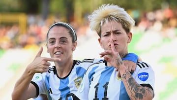 Argentina's Yamila Rodriguez (R) celebrates with Mariana Larroquette (L) after scoring her third goal against Uruguay during the Women's Copa America first round football match at the Centenario stadium in Armenia, Colombia, on July 15, 2022. (Photo by Juan BARRETO / AFP) (Photo by JUAN BARRETO/AFP via Getty Images)