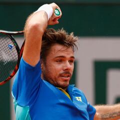 Wawrinka overcomes stumble to oust Kovalik