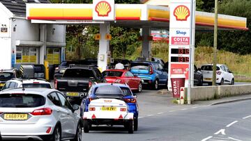 Cars queue up at a petrol and diesel filling station, Begelly, Pembrokeshire, Wales, Britain, September 24, 2021. REUTERS/Rebecca Naden